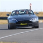 Aston Martin Driving on the Track